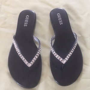 Guess black with silver bling flip-flops. Jasper.
